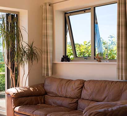 brown-impact-awning-window-with-fixed-panel-for-living-room